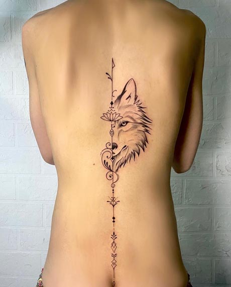 unforgettable half wolf head tattoo fine line girl back spine