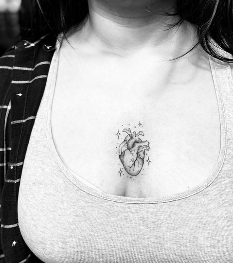 heart-tattoo-design-minimalist-woman-sternum