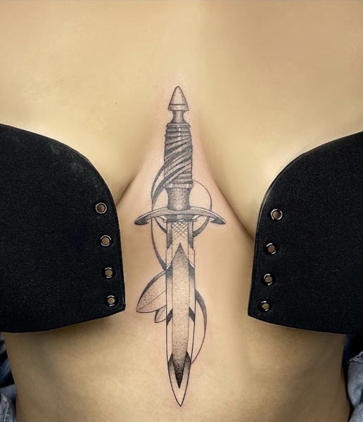 traditional knife tattoo woman sternum black and grey