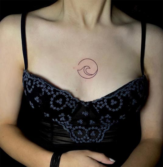 wave tilde tattoo fine line female chest