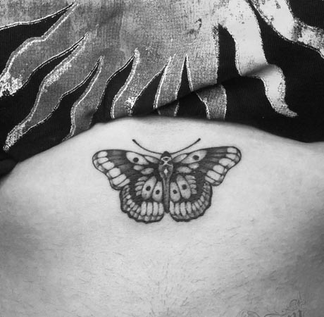 moth simple easy tattoo design female upper stomach