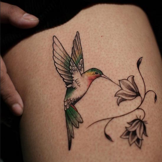 hummingbird with flower tattoo color female thigh