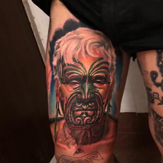 maori man face portrait color tattoo design man inner thigh