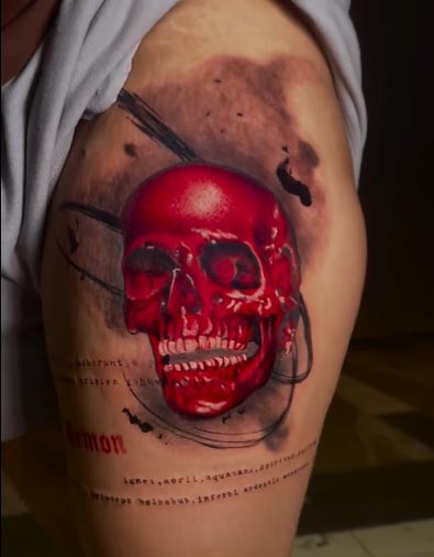 red skull word demon unique tattoo design woman thigh