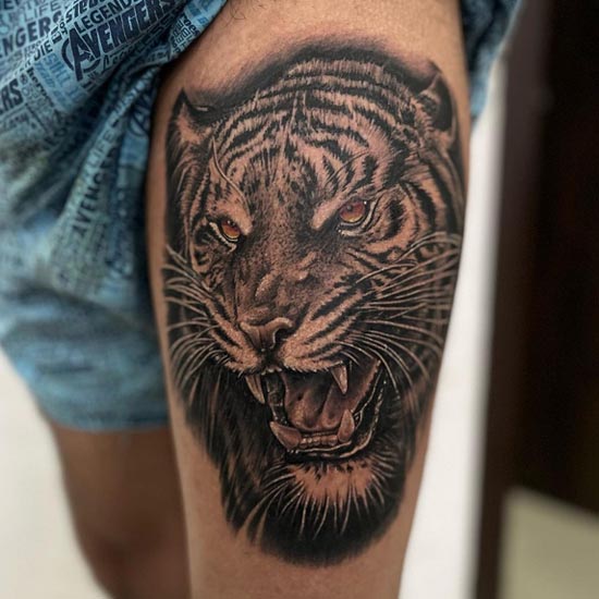 roaring tiger tattoo design black and grey male thigh