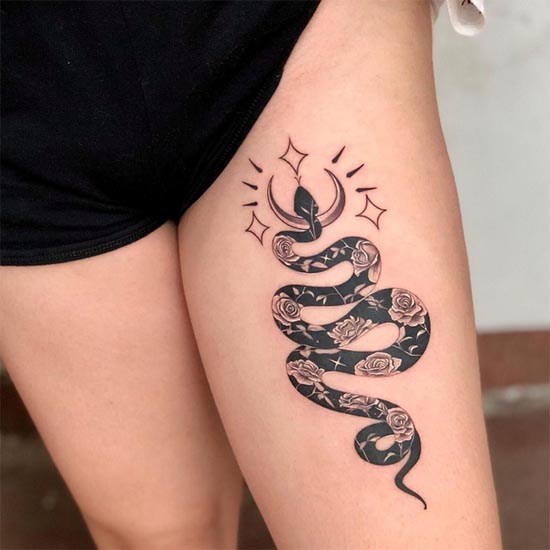 snake crescent moon roses cute elegant tattoo design woman front thigh