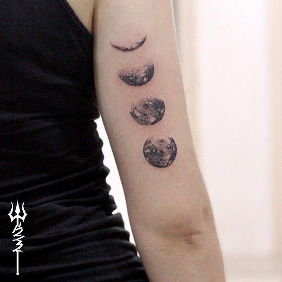 dotwork phases of moon tattoo design female tricep