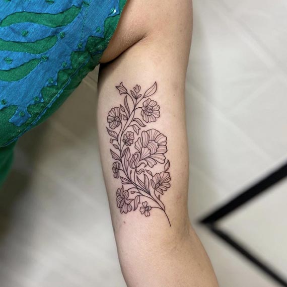 floral linework tattoo design female inner tricep