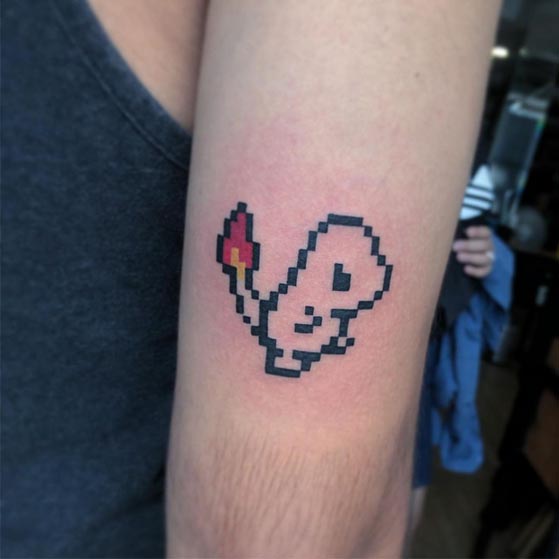 pokemon 8 bit charmander character tattoo male tricep