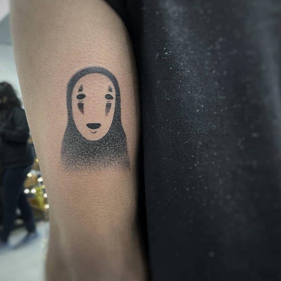 spirited away no face tattoo man tricep