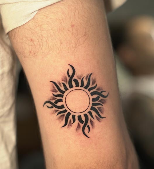 sun good tattoo design idea male tricep