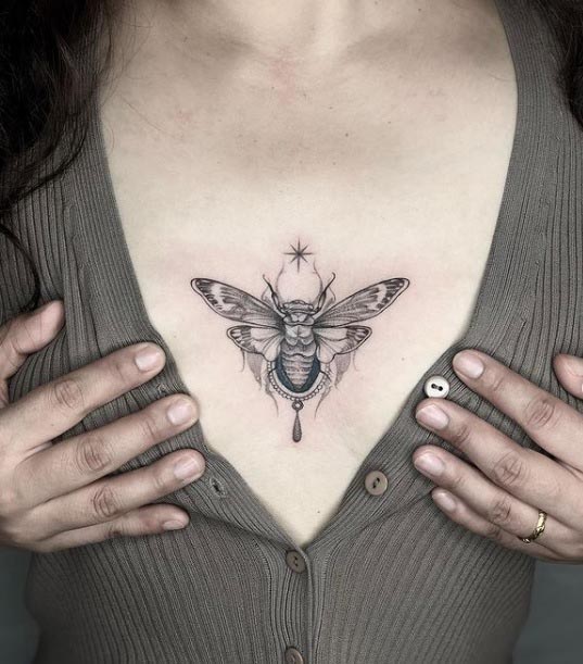 breast cicada tattoo