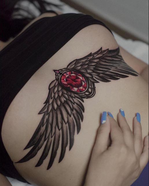 breast ruby ornament wings tattoo