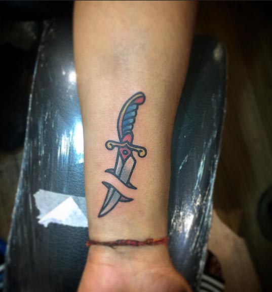 old school dagger tattoo design male wrist