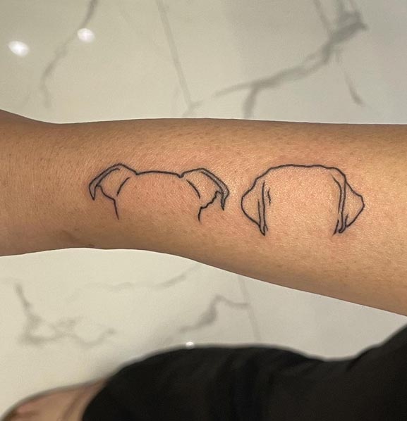 simple 2 dog ear outline tattoo design female side wrist